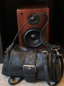 Black vintage textured faux leather shoulder bag with large silver buckle and eyelet strap