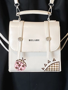 White PU leather school style backpack with Helahe logo and embroidered patterns