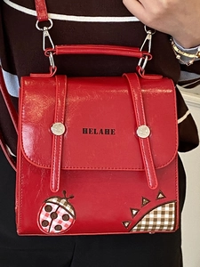 Red casual backpack with ladybug embroidery and stylish triangle patchwork detailing