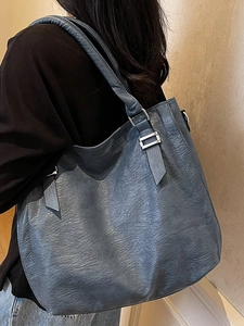 Blue-grey large capacity faux leather tote bag with silver hardware for daily commute