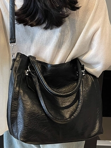 Fashionable black crinkle leather shoulder bag with silver hardware for women
