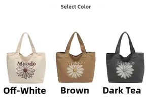 Canvas tote bags with daisy prints in creamy white, brown, and dark grey colors