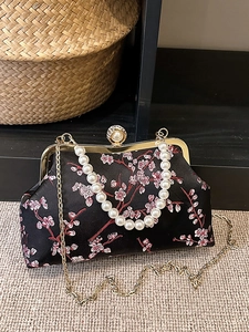 Retro Chinese evening bag with red floral embroidery, pearl handle, and gold chain strap