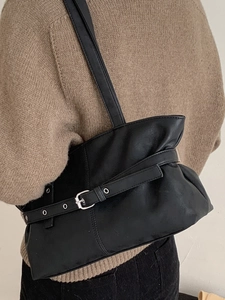 Minimalist black tote shoulder bag for women with adjustable buckle straps and soft texture
