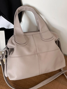 Minimalist large capacity tote bag in dusty rose pebbled leather with crossbody strap