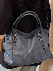 Minimalist grey-blue leather tote bag for women showing soft texture and urban style
