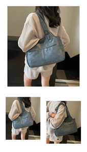 Detailweergave van retro grijsblauwe shopper met ritsen en lychee-leerstructuur