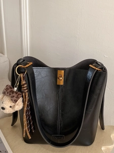 Vintage black bucket bag for women with gold clasp and cute leopard bear charm