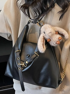 Retro black faux leather tote with metallic eyelets and cute plush bunny charm