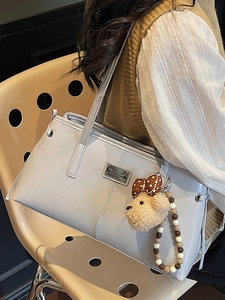 Minimalist light blue faux leather tote bag with cute bear charm and bead chain strap