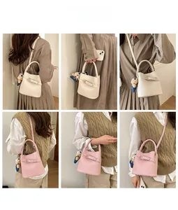 Detail shots of beige and pink bucket bags with cute bear charm and cross strap