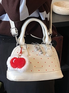 Cute milky white polka dot shell handbag with red apple charm and adjustable strap