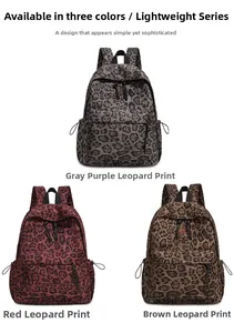 Detailed view of leopard print backpacks in gray-purple, red, and brown with front pockets