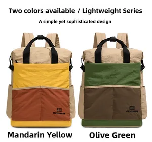 Détail du sac à dos de voyage color-block élégant en nylon orange et vert olive robuste