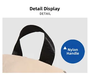 Close-up of durable black nylon braided handle on minimalist beige backpack detail