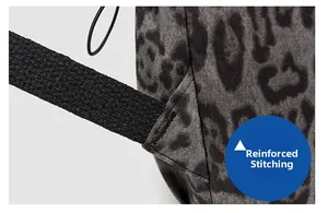 Detail showing bartack reinforcement on the leopard print backpack strap and body