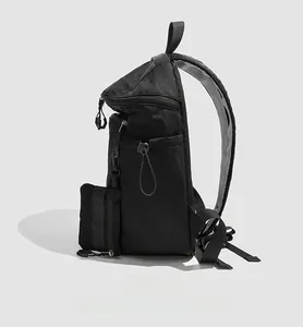 Detail view of the side pocket and wide mesh shoulder strap on the black hiking backpack