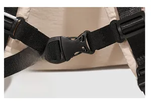 Detail of durable black plastic buckle and premium nylon webbing strap on the backpack