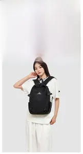 Practical model display showing the fit and size of the black outdoor travel backpack