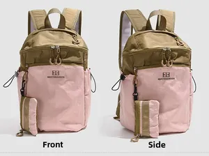 Detail view of pink and olive green hiking backpack with wide breathable shoulder straps