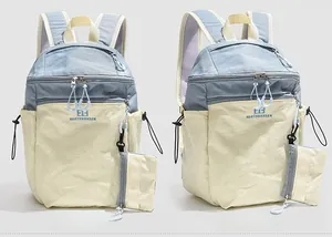 Detail of grey-blue hiking backpack with dual-tone design and side storage pouch
