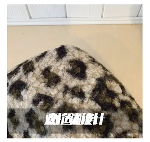 Detailed close-up showing soft leopard print plush texture of the crossbody bag