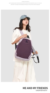 Detail view of purple contrast backpack with double decker design and reflective safety strips