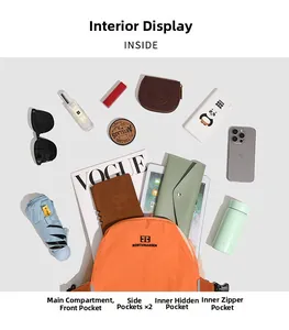 Detail view of the orange backpack interior storage with laptop and daily essentials