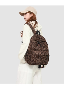 Close-up of leopard print backpack with durable fabric and adjustable shoulder straps