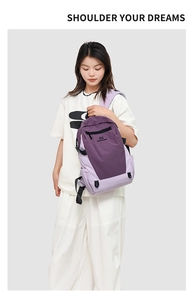 Detail of purple oxford fabric backpack with adjustable straps and side water bottle pocket