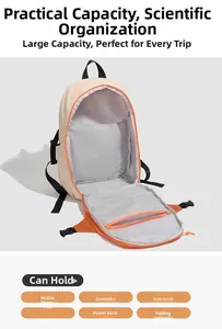 Top view of open backpack showing spacious interior with orange lining and mesh pockets