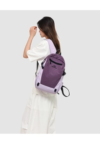 Detail view of the two-tone purple backpack showing side pocket and zipper design