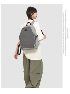 Detail view of the large capacity dual-tone backpack with adjustable straps and side buckles