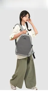 Detail view of water-resistant nylon backpack with contrast panels and padded straps