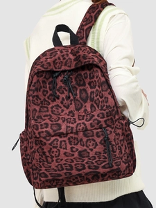 Leopard print backpack with large capacity and drawstring detail for daily commuting