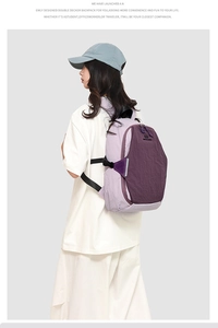 Side view of purple contrast backpack on model showing water-resistant nylon material