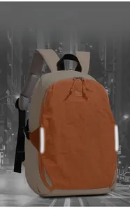 Detail view of the orange backpack showing reflective safety strips and breathable mesh straps