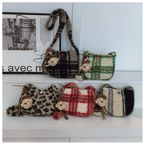 Multiple plush crossbody bags with leopard and plaid patterns featuring cute bear charms