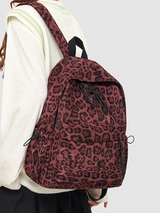 Casual leopard print backpack with large capacity for college students on model