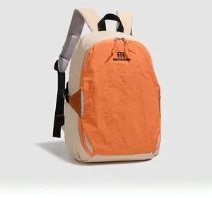 Detail view of the contrasting beige and orange panels with Northnansen logo on backpack