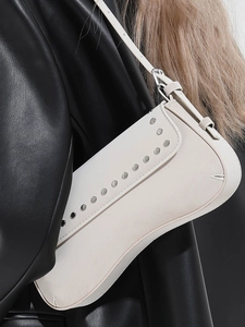Retro cream white half moon underarm bag with decorative silver rivets on matte leather