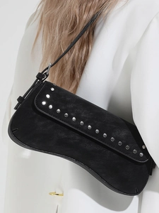 Retro black saddle shoulder bag with silver rivet trim and matte leather finish