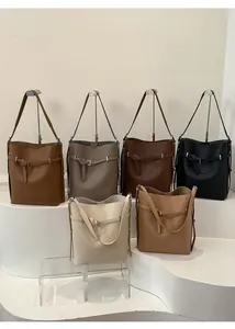 Detail view of large bucket bags in six colors with pebble grain leather texture