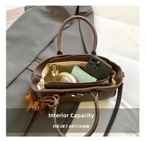 Internal capacity of brown pebble leather handbag with zip compartment for daily essentials