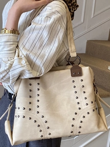 Vintage cream rivet tote bag with metallic studs for women, stylish large shoulder bag
