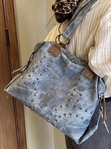 Vintage rivet tote bag in grey-blue washed canvas with spacious shoulder strap design