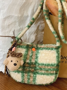 Green and white checkered faux fur crossbody bag with a cute puppy plush charm