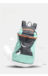 Detail showing lightweight water-resistant nylon fabric and green outdoor hiking backpack