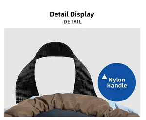 Detail view of the durable black nylon top handle and drawstring closure on backpack