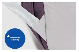Detail showing reinforced bartack stitching on the purple and gray oxford backpack strap